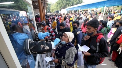 Healthcare worker collects swab sample for Covid-19 test at a hospital in Lucknow, in view of rising Omicron cases, on Wednesday. (ANI Photo) Healthcare worker collects swab sample for Covid-19 test at a hospital in Lucknow, in view of rising Omicron cases, on Wednesday. (ANI Photo)