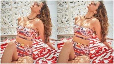 Styled by Chandni Sareen, Ananya left her tresses open in beach wavy curls and added tinted shades to her look. (Instagram/@ananyapanday)