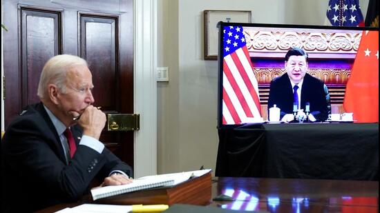 US President Joe Biden meets with China's President Xi Jinping during a virtual summit from the Roosevelt Room of the White House in Washington, DC on November 15, 2021. (AFP)