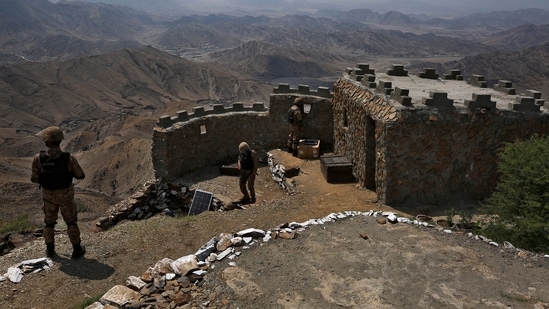 Pakistan Army troops observe the area from hilltop post on the Pakistan Afghanistan, in Khyber district,(AP)