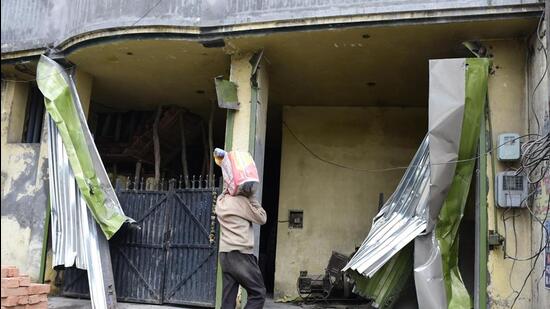 MC officials demolished shutters installed outside a shop owned by Gurpreet Gogi’s supporter near Saggu Chowk in Ludhiana. (Harsimar Pal Singh/HT)