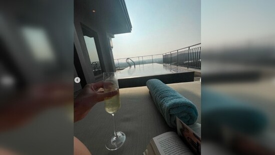Sipping a glass of champagne while enjoying the view, Mouni Roy makes the most out of the moment.(Instagram/@imouniroy)
