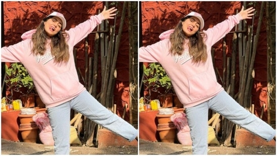 Hina paired the pink hoodie with a multicolour pink cap and added more casual vibes to her look.(Instagram/@realhinakhan)