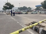 Police personnel cordon off an area after a bomb was found inside a bag at Ghazipur flower market in New Delhi. Police personnel cordon off an area after a bomb was found inside a bag at Ghazipur flower market in New Delhi.