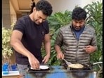 Varun Tej and Chiranjeevi making dosas for other family members at Sankranti celebrations.
