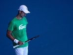 Serbian tennis player Novak Djokovic practices at Melbourne Park as questions remain over the legal battle regarding his visa to play in the Australian Open in Melbourne, Australia, January 13, 2022.