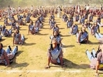 Students performing Surya Namaskar, a form of Yoga, at Mulund Sambhaji ground in Mumbai.