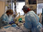 Medical staff treat a Covid-19 patient on the Intensive Care Unit (ICU) at the Cleveland Clinic in Cleveland, Ohio, US.