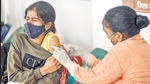 Patna: A health worker administers a COVID-19 vaccine dose to a teenanger, at SKM Hall in Patna, Friday, Jan. 14, 2022. (PTI Photo)(PTI01_14_2022_000164A) (PTI) Patna: A health worker administers a COVID-19 vaccine dose to a teenanger, at SKM Hall in Patna, Friday, Jan. 14, 2022. (PTI Photo)(PTI01_14_2022_000164A) (PTI)
