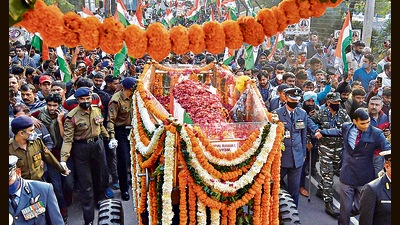 People participate in the funeral procession of CDS Gen Bipin Rawat, in New Delhi on December 10, 2021. (PTI)