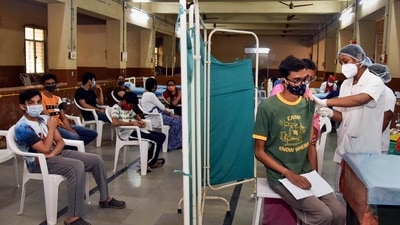 A health worker administers a dose of COVID-19 vaccine to a teenager in Hyderabad. (PTI) A health worker administers a dose of COVID-19 vaccine to a teenager in Hyderabad. (PTI)