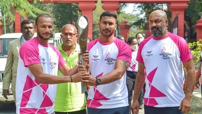 Hockey players V Raghunath (C) and Sunil Kumar (L) take part in a relay of the Queen's Baton for the Birmingham Commonwealth Games at Vidhanasoudha in Bengaluru, Friday, Jan. 14, 2022. (PTI) Hockey players V Raghunath (C) and Sunil Kumar (L) take part in a relay of the Queen's Baton for the Birmingham Commonwealth Games at Vidhanasoudha in Bengaluru, Friday, Jan. 14, 2022. (PTI)