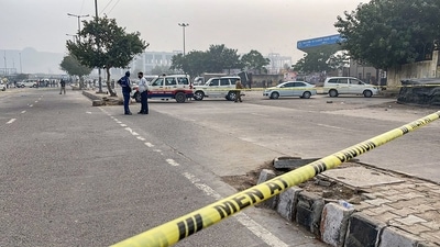 Police personnel cordon off an area after a bomb was found inside a bag at Ghazipur flower market in New Delhi. (PTI) Police personnel cordon off an area after a bomb was found inside a bag at Ghazipur flower market in New Delhi. (PTI)