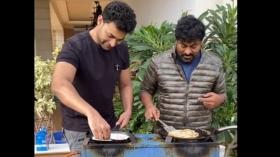 Varun Tej and Chiranjeevi making dosas for other family members at Sankranti celebrations. Varun Tej and Chiranjeevi making dosas for other family members at Sankranti celebrations.
