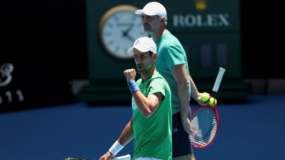 Serbian tennis player Novak Djokovic gestures as he practices at Melbourne Park as questions remain over the legal battle regarding his visa to play in the Australian Open in Melbourne, Australia, January 13, 2022 (REUTERS)