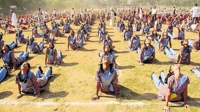 Students performing Surya Namaskar, a form of Yoga, at Mulund Sambhaji ground in Mumbai. (Praful Gangurde/HT File Photo)