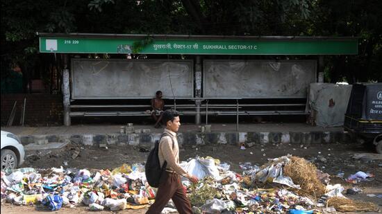 Gurugram, India - September 19, 2019: Garbage accumulated in front of Gurugram Management Development Authority (GMDA) Bus Q Shelter, at Sukhrali Sector - 17C, in Gurugram, India, on Thursday, September 19, 2019. (Photo by Parveen Kumar / Hindustan Times)