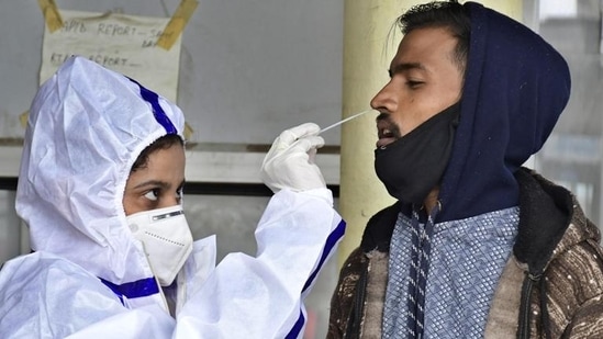 A health worker collecting swab samples for Covid testing at Urban Community Health Centre in Ludhiana. (HT Photo) A health worker collecting swab samples for Covid testing at Urban Community Health Centre in Ludhiana. (HT Photo)