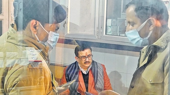 Police personnel arrest Wasim Rizvi alias Jitendra Narayan Tyagi in connection with the three-day-long hate speech conclave in December, in Haridwar.