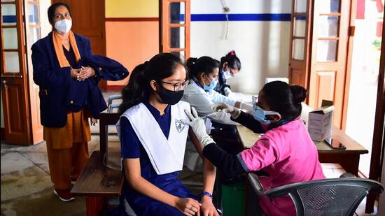 A health worker inoculates a student with a dose of the Covaxin Covid-19 vaccine at a school in Allahabad, India on Wednesday. Bharat Biotech’s North American partner submitted Covaxin for emergency use approval from Health Canada six months ago but the review is still ‘ongoing’. (AFP)