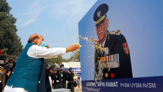 Defence minister Rajnath Singh paying floral tributes to the portrait of first Chief of Defence Staff (CDS) General Bipin Rawat.(ANI) Defence minister Rajnath Singh paying floral tributes to the portrait of first Chief of Defence Staff (CDS) General Bipin Rawat.(ANI)