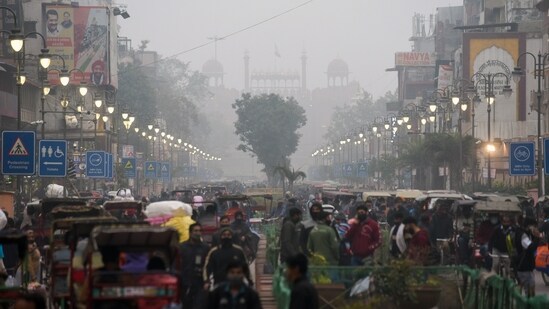 People throng Chandni Chowk market, in New Delhi on Friday a day ahead of weekend lockdown.&nbsp;