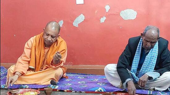 Uttar Pradesh chief minister Yogi Adityanath has lunch at a Dalit household in Gorakhpur on Friday. Elections in the state are scheduled to be held from February 10. (ANI)