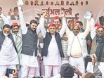 Former UP minister Swami Prasad Maurya and others join the Samajwadi Party in presence of party president Akhilesh Yadav in Lucknow on Friday.&nbsp;(PTI)