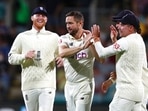 England's Chris Woakes, second left, is congratulated by teammates after he took the wicket of Australia's Marnus Labuschagne during their Ashes cricket test match in Hobart, Australia, Saturday, Jan. 15, 2022. (AP Photo/Tertius Pickard)(AP) England's Chris Woakes, second left, is congratulated by teammates after he took the wicket of Australia's Marnus Labuschagne during their Ashes cricket test match in Hobart, Australia, Saturday, Jan. 15, 2022. (AP Photo/Tertius Pickard)(AP)