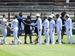 India players congratulate South Africa plyers after South Africa won the third Test.