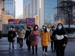 People walk on a street as the coronavirus disease (Covid-19) outbreak continues in Beijing, China &nbsp;&nbsp;