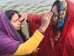 Hindu women apply vermilion (Sindoor) after taking holy dip in the Ganga River on the occasion of Makar Sankranti festival.(PTI) Hindu women apply vermilion (Sindoor) after taking holy dip in the Ganga River on the occasion of Makar Sankranti festival.(PTI)