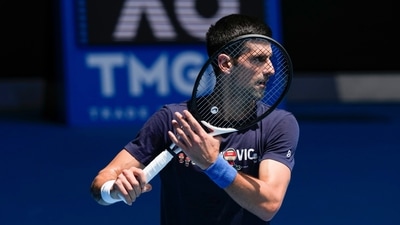 Defending men's champion Serbia's Novak Djokovic practices on Rod Laver Arena ahead of the Australian Open tennis championship in Melbourne, Australia, Jan. 12, 2022. Djokovic’s effort to play in the Australian Open despite being unvaccinated for COVID-19 moved to a higher court as the No. 1-ranked tennis player appealed the second cancellation of his visa. A judge scheduled another hearing for Sunday, (AP) Defending men's champion Serbia's Novak Djokovic practices on Rod Laver Arena ahead of the Australian Open tennis championship in Melbourne, Australia, Jan. 12, 2022. Djokovic’s effort to play in the Australian Open despite being unvaccinated for COVID-19 moved to a higher court as the No. 1-ranked tennis player appealed the second cancellation of his visa. A judge scheduled another hearing for Sunday, (AP)