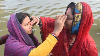 Hindu women apply vermilion (Sindoor) after taking holy dip in the Ganga River on the occasion of Makar Sankranti festival. (PTI) Hindu women apply vermilion (Sindoor) after taking holy dip in the Ganga River on the occasion of Makar Sankranti festival. (PTI)