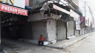 The Lajpat Nagar market wears a deserted look during the weekend curfew imposed by the Delhi government to curb the spread of Covid-19 in New Delhi, Saturday, Jan. 15, 2022. (PTI) The Lajpat Nagar market wears a deserted look during the weekend curfew imposed by the Delhi government to curb the spread of Covid-19 in New Delhi, Saturday, Jan. 15, 2022. (PTI)
