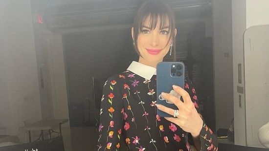 Proving that florals are a mainstay in our wardrobe each season, Anne took to her social media handle and shared a slew of pictures from her recent outing that featured her donning a black base mini dress that was made from a wool-blend and comprised a multi-coloured printed floral fabric. &nbsp;(Instagram/annehathaway)