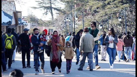 Tourists enjoying a stroll in Shimla on Saturday afternoon. The Himachal Pradesh government has revised guidelines for holding social and religious gatherings. (Deepak Sansta/HT)