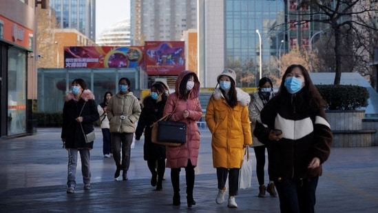 People walk on a street as the coronavirus disease (Covid-19) outbreak continues in Beijing, China &nbsp;&nbsp;(REUTERS/Thomas Peter)
