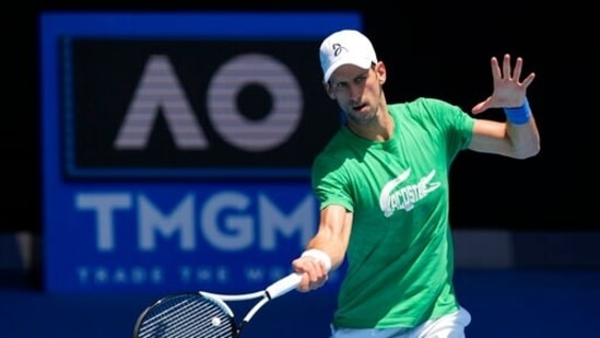 FILE - Defending men's champion Serbia's Novak Djokovic practices on Margaret Court Arena ahead of the Australian Open tennis championship in Melbourne, Australia, Thursday, Jan. 13, 2022.(AP)