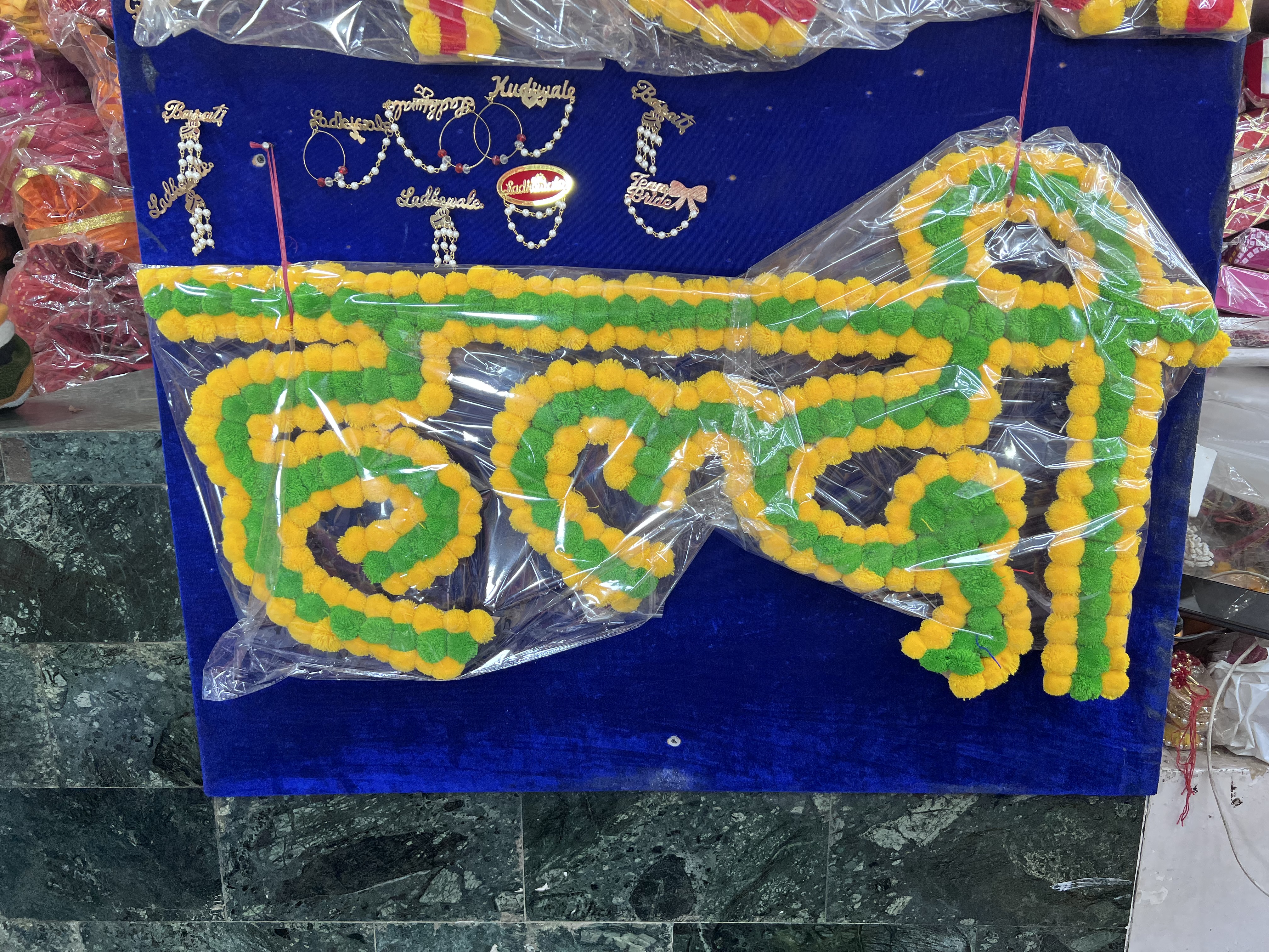 Made from artificial flowers, these wall hangings can be customised for the occasion. (Photo: Dhruv Sethi/HT) Made from artificial flowers, these wall hangings can be customised for the occasion. (Photo: Dhruv Sethi/HT)