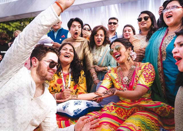 It is a picture shot during Priyanka’s mehendi where all the aunts are there and Nick has found his name on her hand. It is shot with the camera right in there. I love how this image breaks the boundaries. Every celebrity photo till then was shot from a certain distance. But here the camera is right in the middle of the action. And that is extraordinary (Joseph Radhik) It is a picture shot during Priyanka’s mehendi where all the aunts are there and Nick has found his name on her hand. It is shot with the camera right in there. I love how this image breaks the boundaries. Every celebrity photo till then was shot from a certain distance. But here the camera is right in the middle of the action. And that is extraordinary (Joseph Radhik)