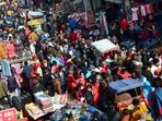 People flout Covid-appropriate behaviour at Sadar Bazar market in Gurugram on Sunday. 