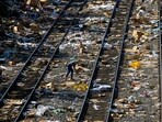 A member of the media picks up a shredded box at a section of the Union Pacific train tracks in downtown Los Angeles.(AP)