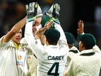 Australia's Scott Boland, left, celebrates with teammates after bowling out England's Joe Root during their Ashes cricket test match in Hobart, Australia.(AP) Australia's Scott Boland, left, celebrates with teammates after bowling out England's Joe Root during their Ashes cricket test match in Hobart, Australia.(AP)