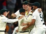 Australia's Pat Cummins, second right, celebrates with teammates after taking England's last wicket of the match and series.(AP) Australia's Pat Cummins, second right, celebrates with teammates after taking England's last wicket of the match and series.(AP)