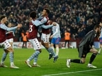 Aston Villa's Philippe Coutinho celebrates scoring their second goal with Carney Chukwuemeka and Matty Cash
