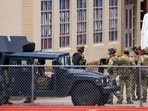 Law enforcement teams stage near Congregation Beth Israel while conducting SWAT operations in the 6100 block of Pleasant Run Road in Colleyville, Texas. Law enforcement teams stage near Congregation Beth Israel while conducting SWAT operations in the 6100 block of Pleasant Run Road in Colleyville, Texas.