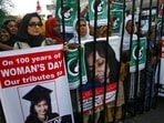 People rally demanding the release of Aafia Siddiqui, who was convicted in February 2010 of two counts of attempted murder, and who is currently being detained in the U.S. during International Women's Day in Karachi, Pakistan, (AP) People rally demanding the release of Aafia Siddiqui, who was convicted in February 2010 of two counts of attempted murder, and who is currently being detained in the U.S. during International Women's Day in Karachi, Pakistan, (AP)