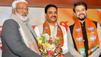 UP polls: Former Kanpur police commissioner Asim Arun flanked by UP BJP chief Swatantra Dev and Union minister Anurag Thakur on Sunday. (ANI PHOTO) UP polls: Former Kanpur police commissioner Asim Arun flanked by UP BJP chief Swatantra Dev and Union minister Anurag Thakur on Sunday. (ANI PHOTO)