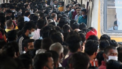 People crowd up at Dadar station flouting social distancing norms as they wait to board a local train as Central Railways operate Mega Block on its suburban sections for carrying out maintenance work, in Mumbai on Sunday. People crowd up at Dadar station flouting social distancing norms as they wait to board a local train as Central Railways operate Mega Block on its suburban sections for carrying out maintenance work, in Mumbai on Sunday. 